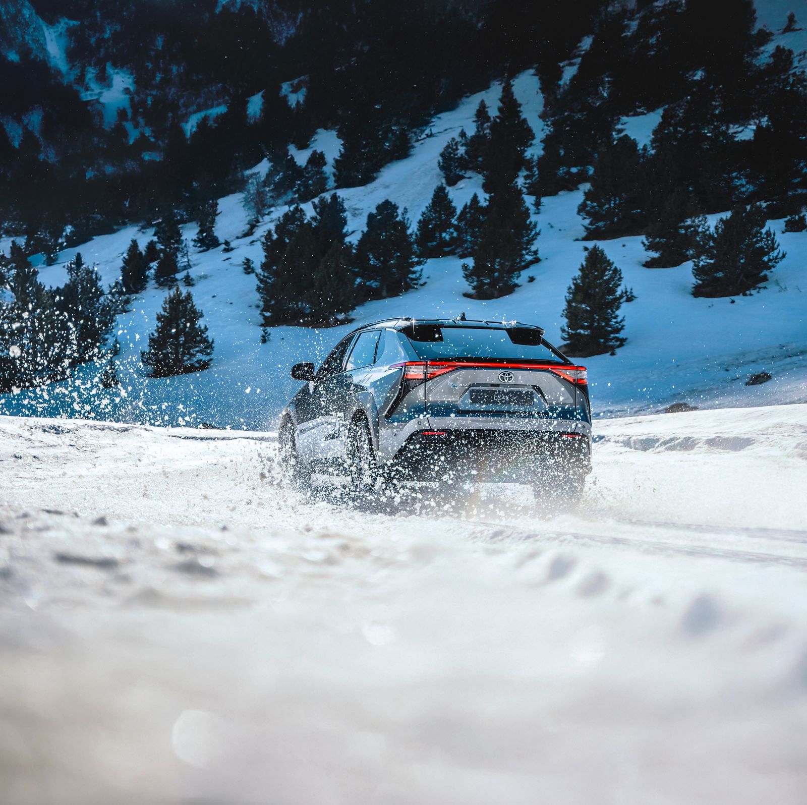A Toyota bZ on a snowy track