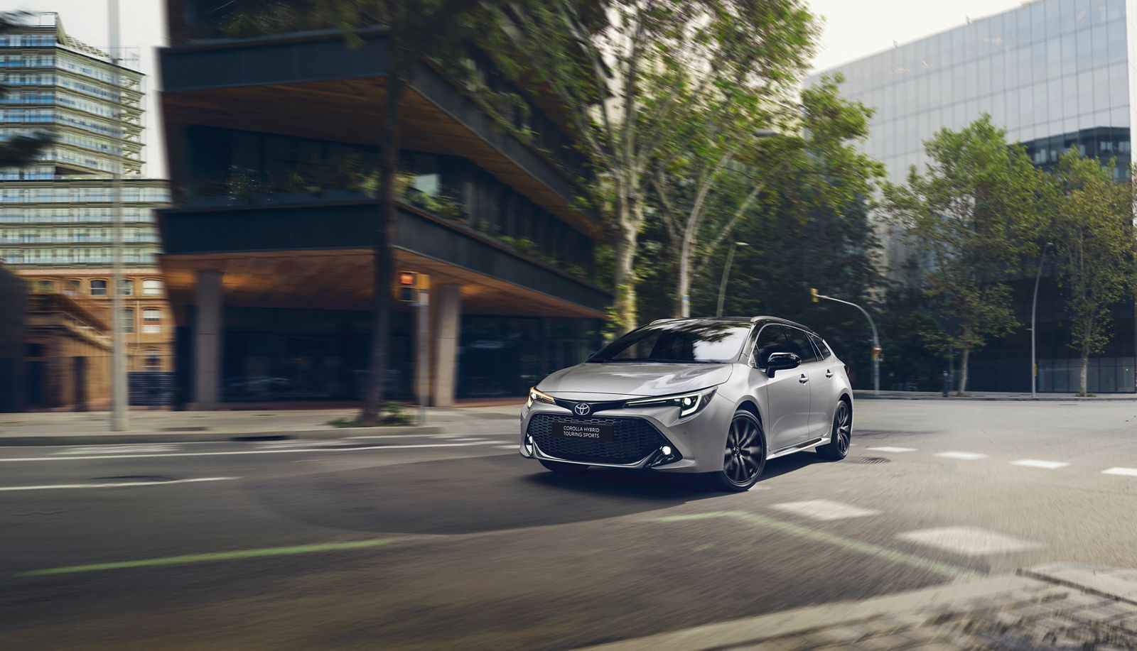 A Corolla driving through a city junction