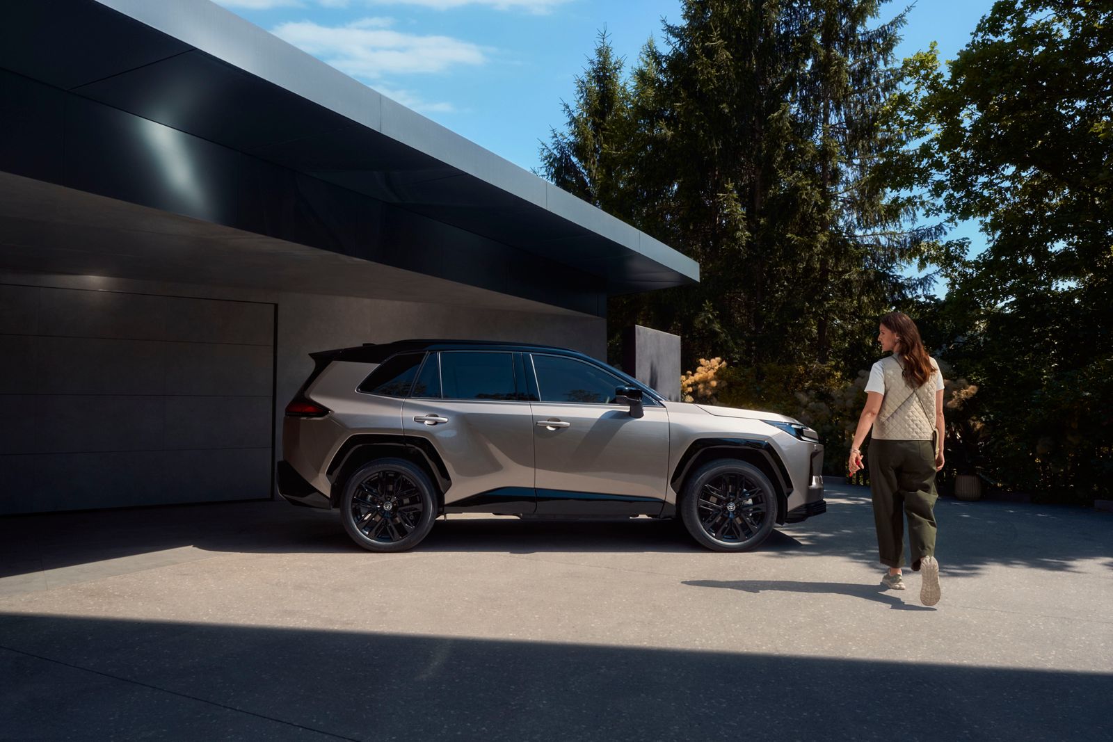 RAV4 driver approaching RAV4 parked outside house